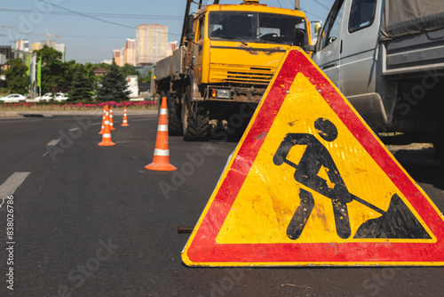 Close-up of a road works sign in the city