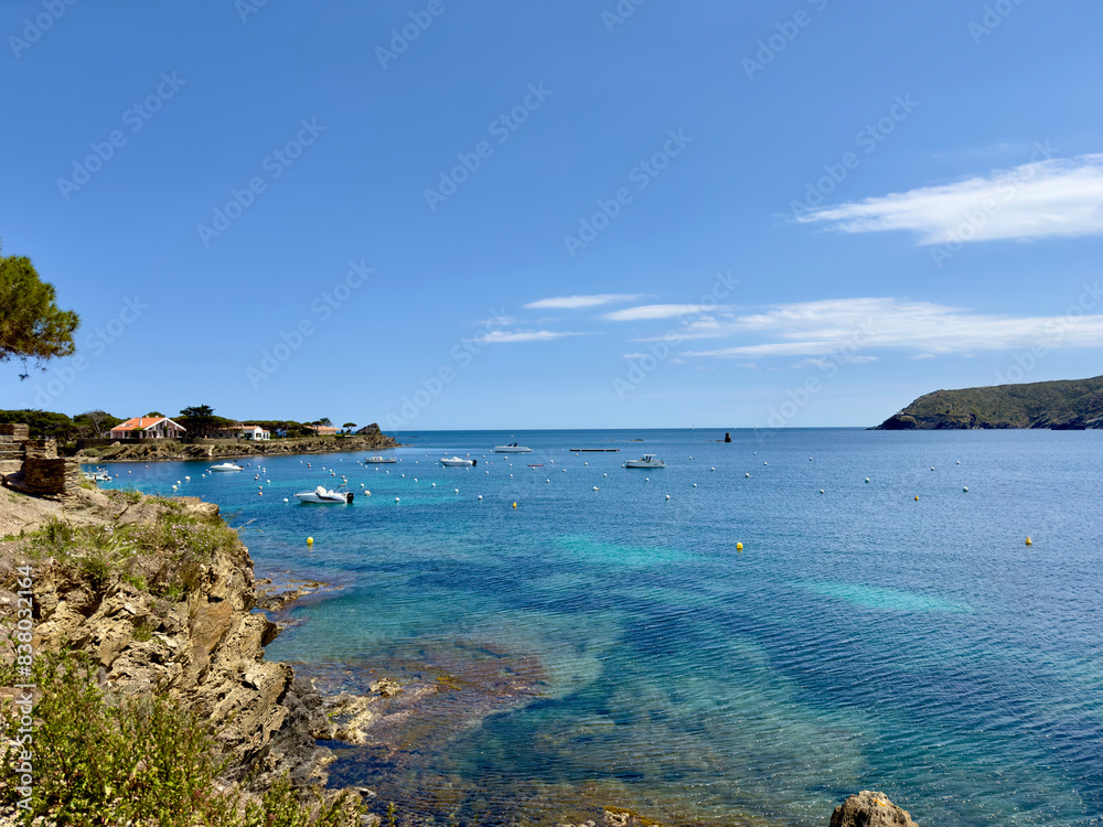 Obraz premium view from the Platja Ses Oliveres to the Badia de Cadaqués, bay with wonderful turquoise colored water near Cadaqués, Catalonia, Girona, Spain