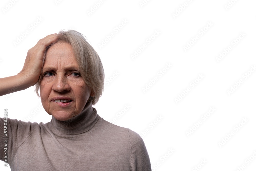 Portrait of an excited senior woman with gray hair on a background with copy space Portrait of an excited senior woman with gray hair on a background with copy space