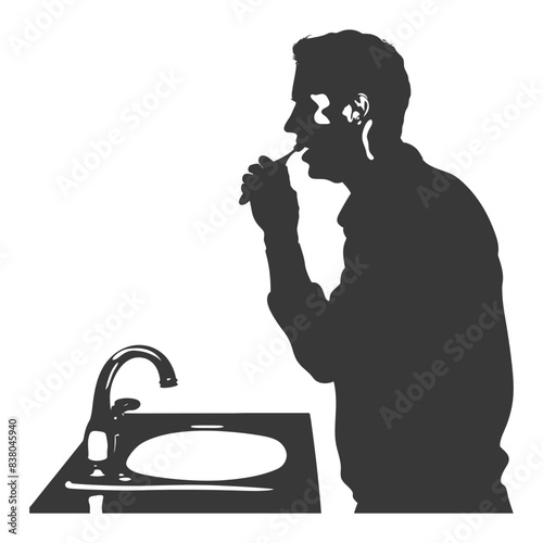 Silhouetted Man Brushing Teeth at Sink, Early Morning Routine.