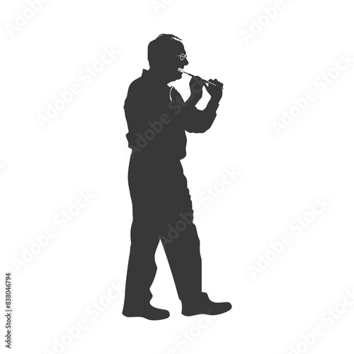 Silhouette of a Man Playing a Traditional Irish Tin Whistle.