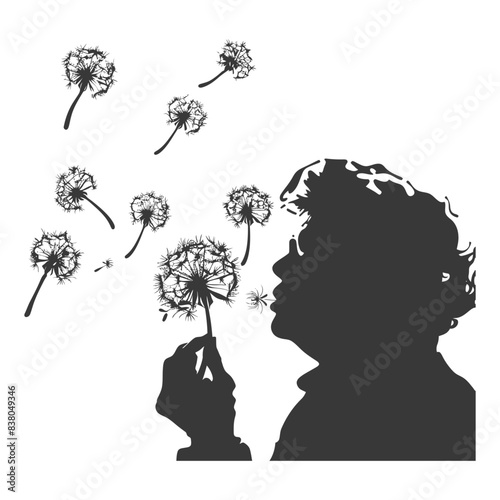 silhouette elderly woman blows dandelion flower black color only