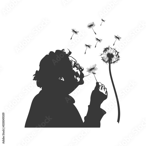 silhouette elderly woman blows dandelion flower black color only