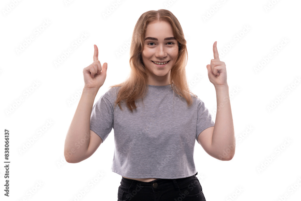 European teenager girl with blond hair and braces with active gesticulation European teenager girl with blond hair and braces with active gesticulation