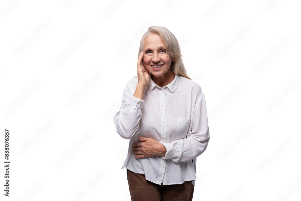 European senior business woman with gray hair wearing a shirt on a white background European senior business woman with gray hair wearing a shirt on a white background