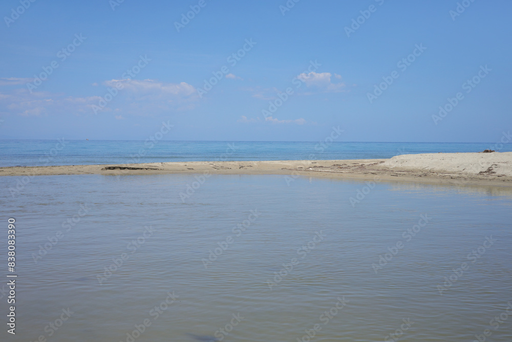 A lagoon on the beach of Nei Pori, Olympic Riviera - Greece A lagoon on the beach of Nei Pori, Olympic Riviera - Greece