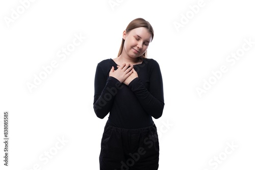 Portrait of a kind European schoolgirl on a white background with copyspace