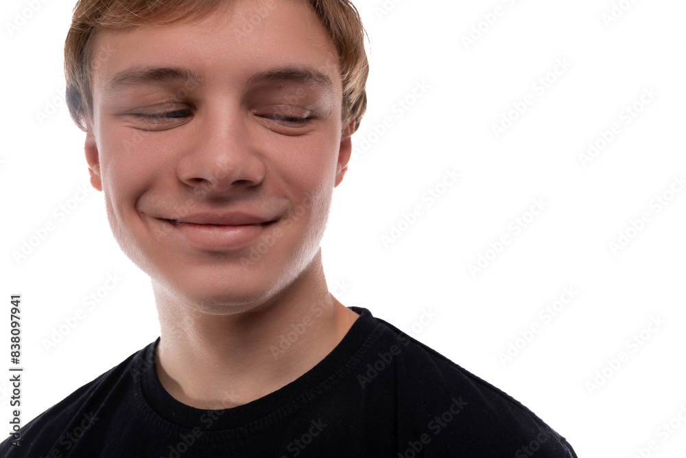 Headshot portrait of a blond teenager young man with a short haircut with his eyes closed Headshot portrait of a blond teenager young man with a short haircut with his eyes closed