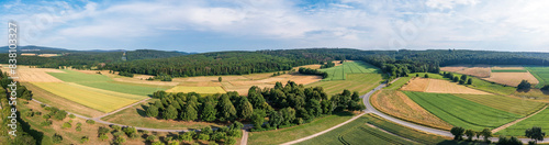 Panoramic bird's eye view of fields, meadows and forests in the Taunus