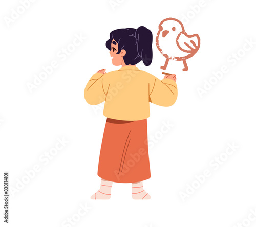 Cute little girl stands, drawing with crayons on the wall back view. Happy creative kid painting bird, chicken with chalk. Child has fun, creates doodle art. Flat isolated vector illustration on white