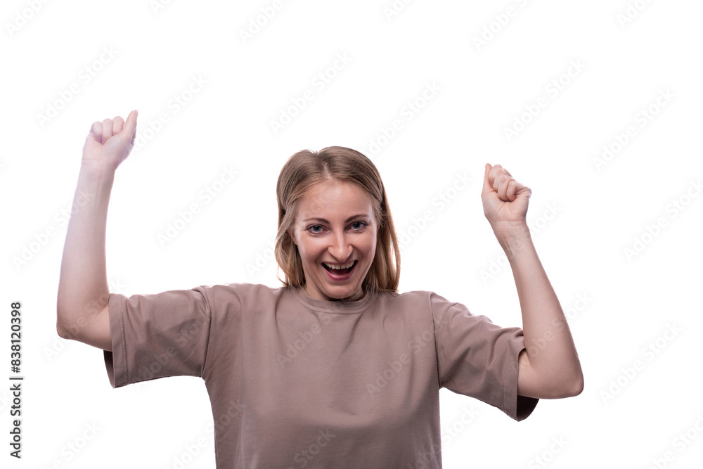 Portrait of a funny Caucasian blond woman in a T-shirt with grimaces on her face Portrait of a funny Caucasian blond woman in a T-shirt with grimaces on her face