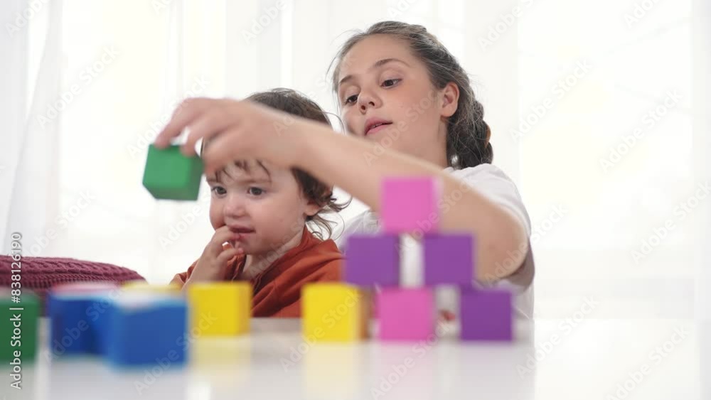 child baby group playing cubes close-up. education a children development of fine motor skills concept. child baby group close-up hands plays with blocks develops fine motor lifestyle skills