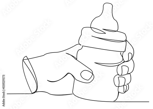 hand with a baby bottle for babies