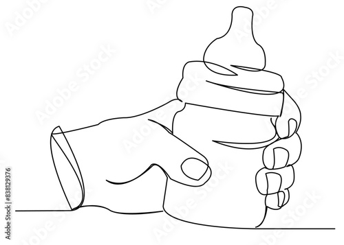 hand with a baby bottle for babies