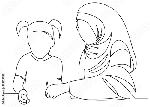 Muslim woman doing homework with her daughter