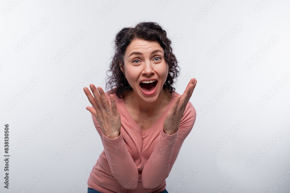 Portrait of a joyful curly woman with a short haircut in a pink blouse Portrait of a joyful curly woman with a short haircut in a pink blouse
