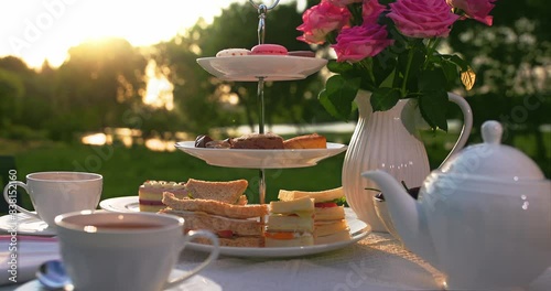 Traditional English afternoon tea on warm summer afternoon.