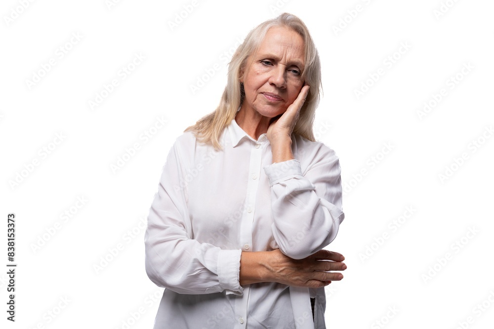 Portrait of an elderly business woman with gray hair in a shirt Portrait of an elderly business woman with gray hair in a shirt