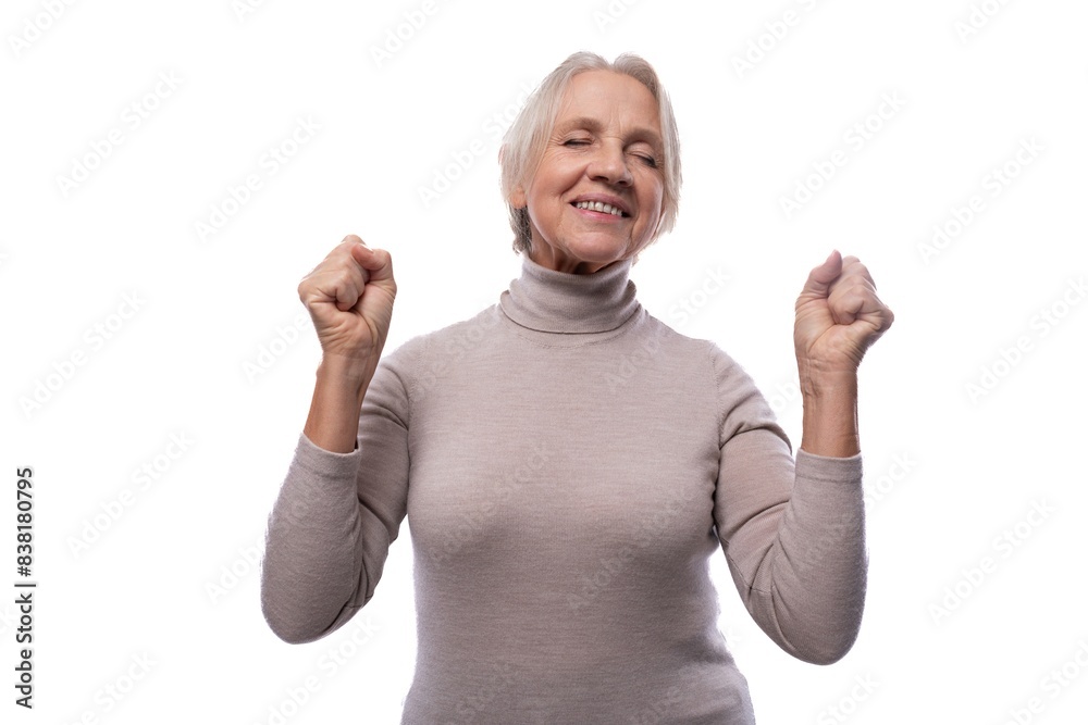 60 year old Caucasian woman with short hair feels joy and happiness 60 year old Caucasian woman with short hair feels joy and happiness