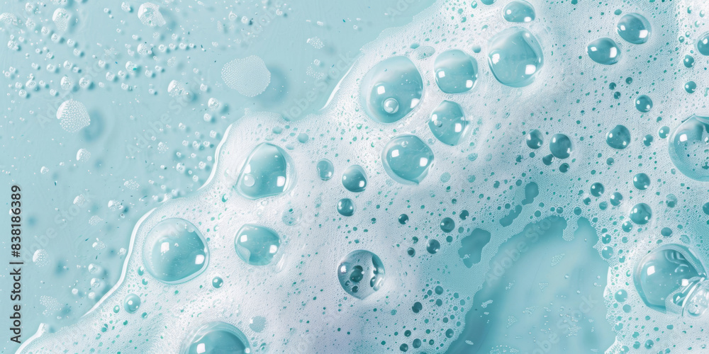 Top view of soapy water on light blue background. Top view of soapy water on light blue background.