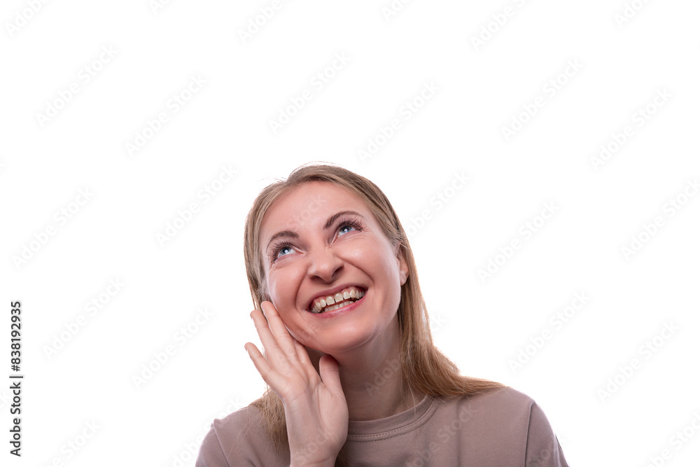 Satisfied woman 40 years old with blond hair on a white background Satisfied woman 40 years old with blond hair on a white background