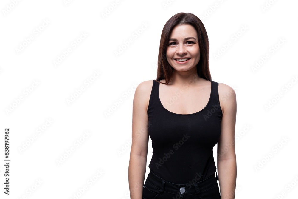 Young slim brunette woman wearing a tight T-shirt on a white background