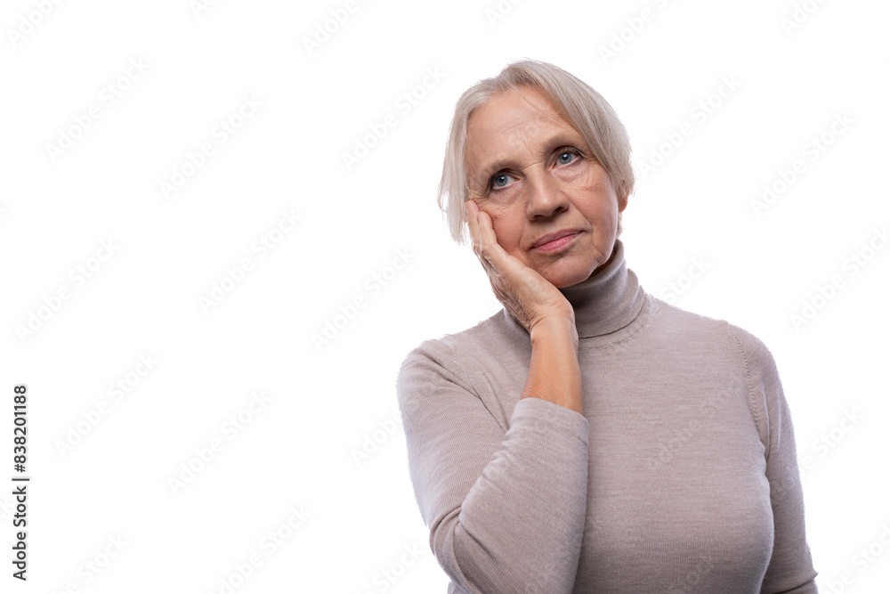 Mature woman with gray hair is worried and sad Mature woman with gray hair is worried and sad