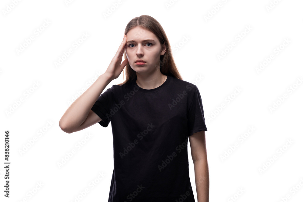 Distressed fair-haired teenage girl in a black T-shirt Distressed fair-haired teenage girl in a black T-shirt