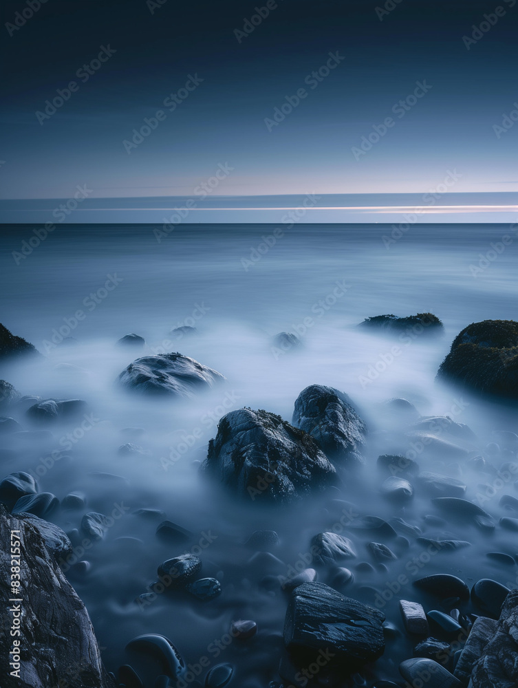 Fototapeta premium Photorealistic poster, view of calm dark sea, rocks going into the water, beautiful calm, concept of silence, tranquility and relaxation