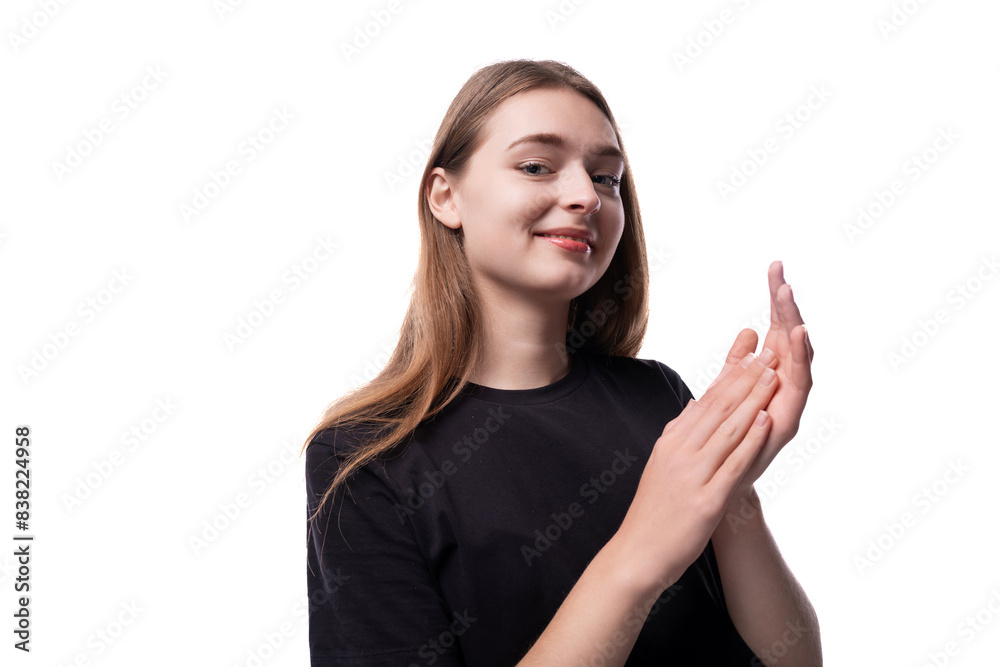 Cute schoolgirl girl with blond hair in a black T-shirt Cute schoolgirl girl with blond hair in a black T-shirt
