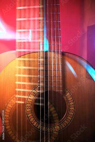 overlay multiple exposure music background closeup, guitar neck and strings,  beautiful filmic, artistic shots.
Cinematic shot  in red neon pink light