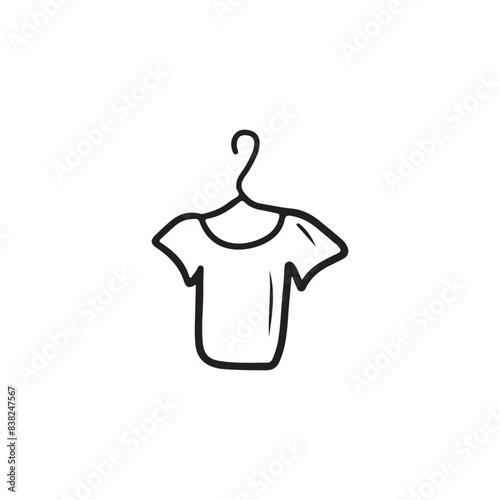 Beautiful t-shirt on the hanger in shopwindow in black isolated on white background. Hand drawn vector sketch illustration in doodle engraved line art vintage style. Fashion, style, shopping