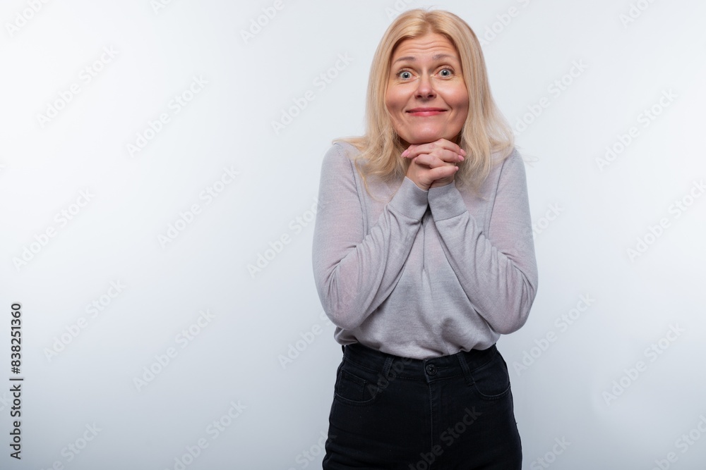 Charming 45 year old woman with blond hair is inspired and surprised Charming 45 year old woman with blond hair is inspired and surprised