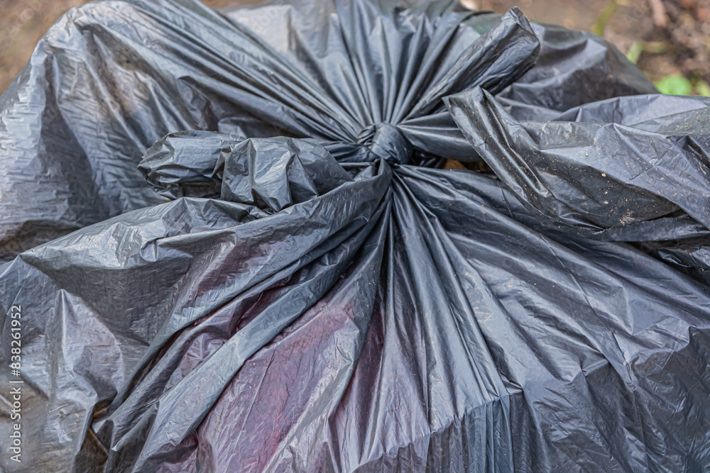 Black plastic garbage bags.Bags to put things left in the house. Black plastic garbage bags.Bags to put things left in the house.