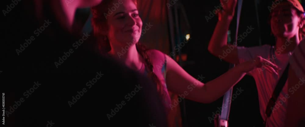 Vibrant friends dancing at a music festival Vibrant friends dancing at a music festival