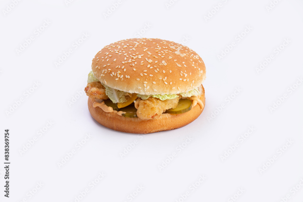 Burger with chicken strips and salad. Burger with chicken strips and salad.