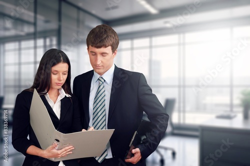 Happy young professional businessman and woman discussing project © BillionPhotos.com