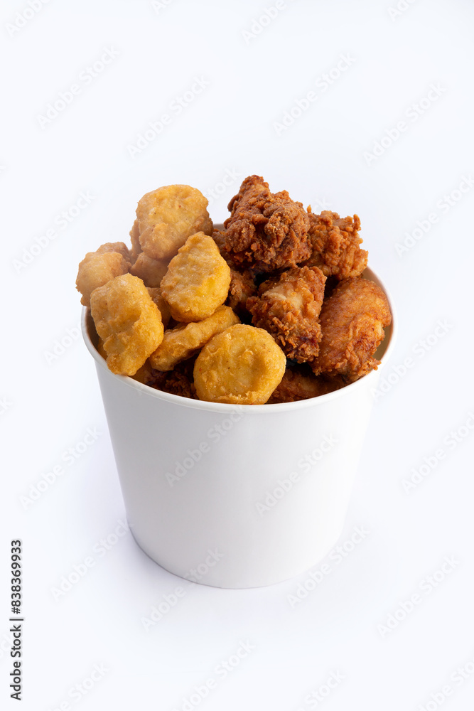 Fried chicken wings and nuggets in a bucket. Fried chicken wings and nuggets in a bucket.