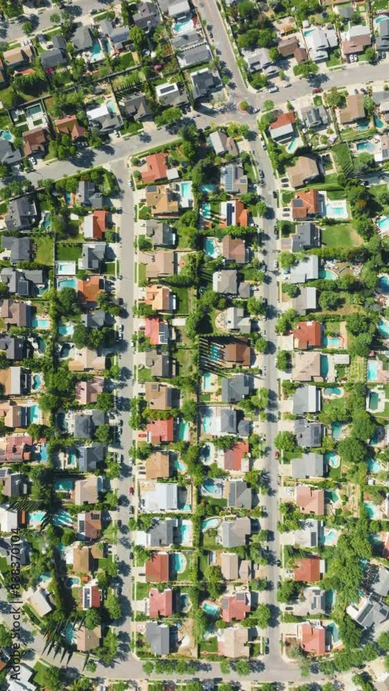 Enjoy the picturesque suburban view from a high point, showcasing green spaces, pools, and houses. Delve into the intricacies of city design and urban structure while observing from above Enjoy the picturesque suburban view from a high point, showcasing green spaces, pools, and houses. Delve into the intricacies of city design and urban structure while observing from above