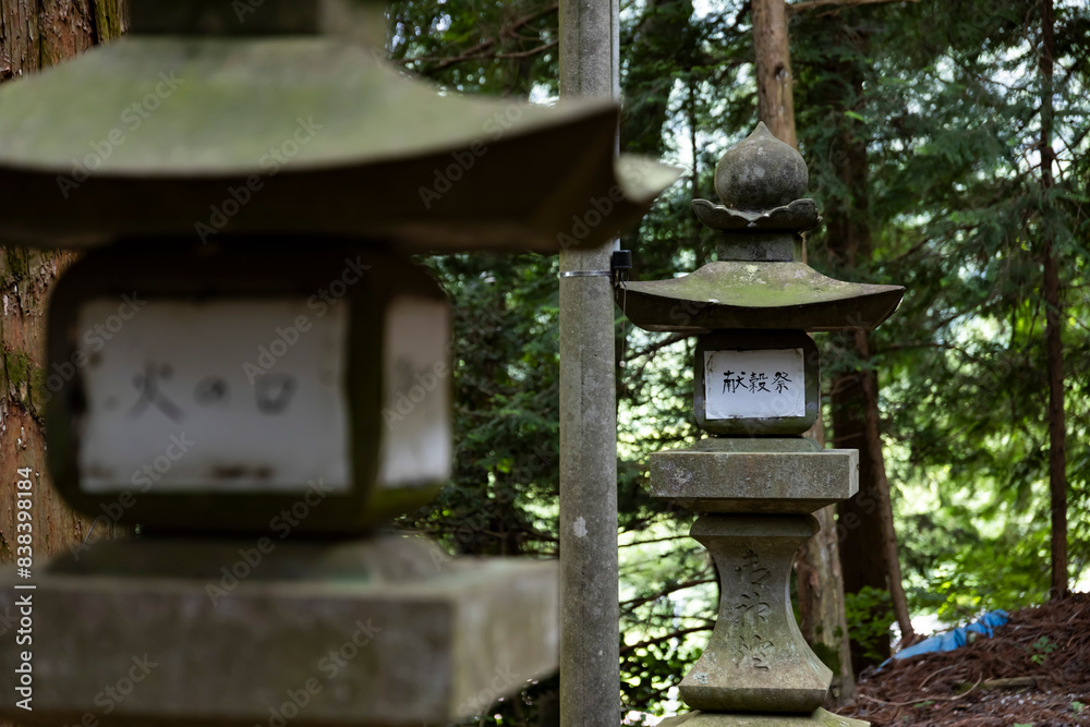 Old Stone lanterns at Japanese old shrine at the countryside front blur Old Stone lanterns at Japanese old shrine at the countryside front blur