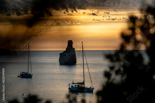 Sunset on Benirras beach in Ibiza in summer photo