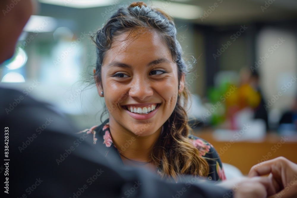 Young Latina Woman Smiling as She Receives Work Permit in Government Office, Late Morning Young Latina Woman Smiling as She Receives Work Permit in Government Office, Late Morning