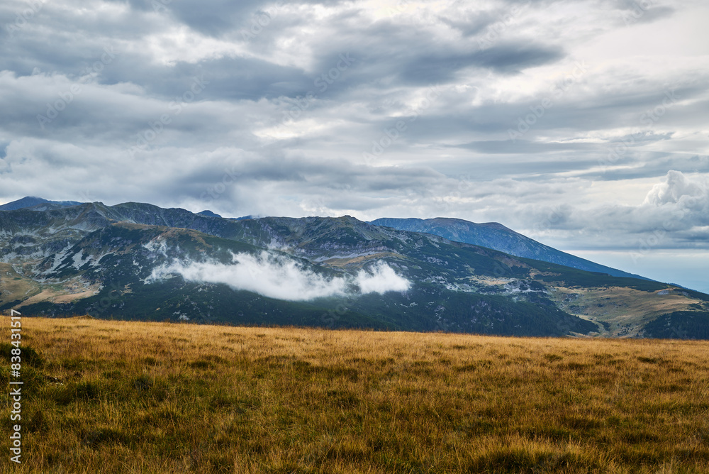 The sky is dark with very black clouds over the field on the Transalpina. Dramatic sky ready for the storm The sky is dark with very black clouds over the field on the Transalpina. Dramatic sky ready for the storm