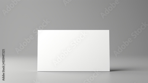 High-Quality White Paper Wall Mockup in a Grey Studio Setting: Perfect for Design Presentations and Background Displays