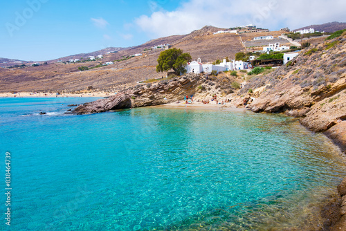 Paralia Agios Sostis wild and free beach in the north of Mykonos, Greece. Pristine bay with blue sea and crystal water, famous for naturism and Kiki's Tavern, peaceful and quiet. photo