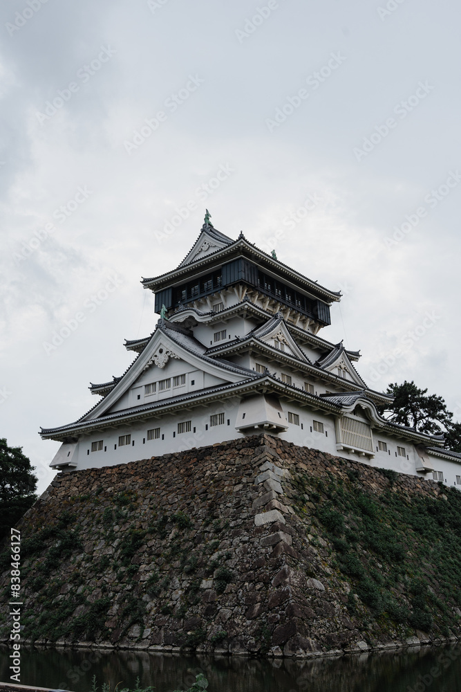 Traditional Japanese Castle Against Cloudy Sky Traditional Japanese Castle Against Cloudy Sky