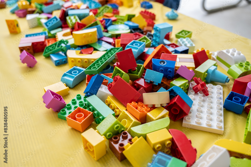 Unorganized pile of kids building blocks of various shapes and sizes are ready to be stacked Unorganized pile of kids building blocks of various shapes and sizes are ready to be stacked