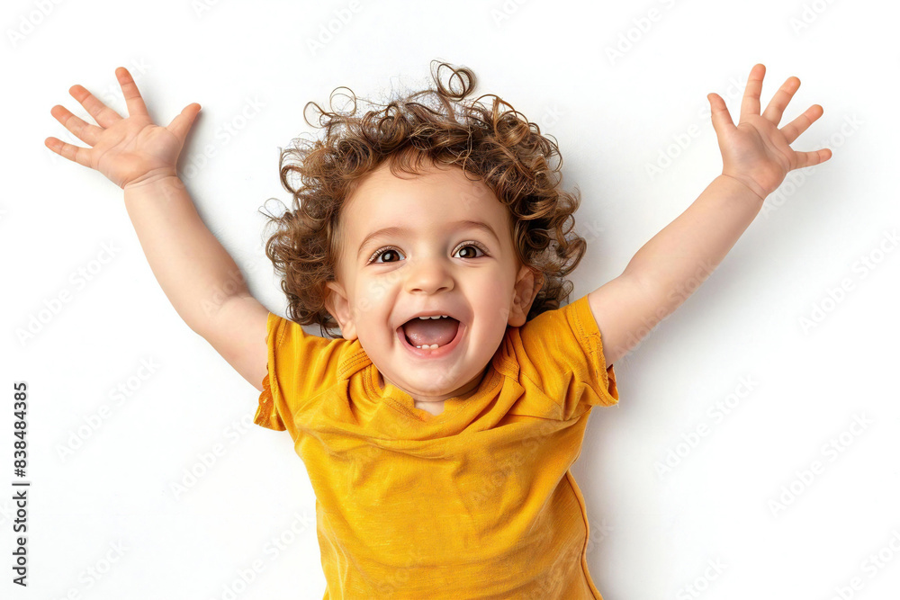 Excited Caucasian toddler cheering and bouncing with joy Excited Caucasian toddler cheering and bouncing with joy