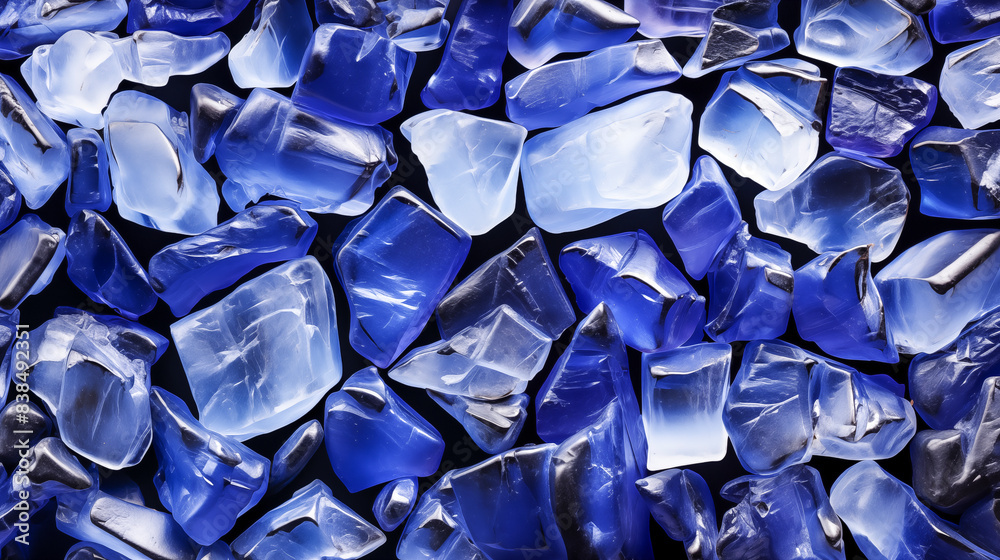 Fototapeta premium A Sea of Blue: Shimmering Sea Glass Fragments Glisten Under the Summer Sun