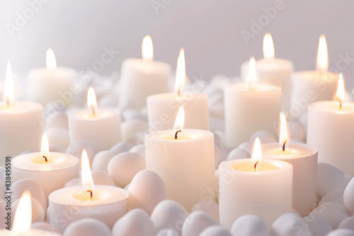 white candles over white background